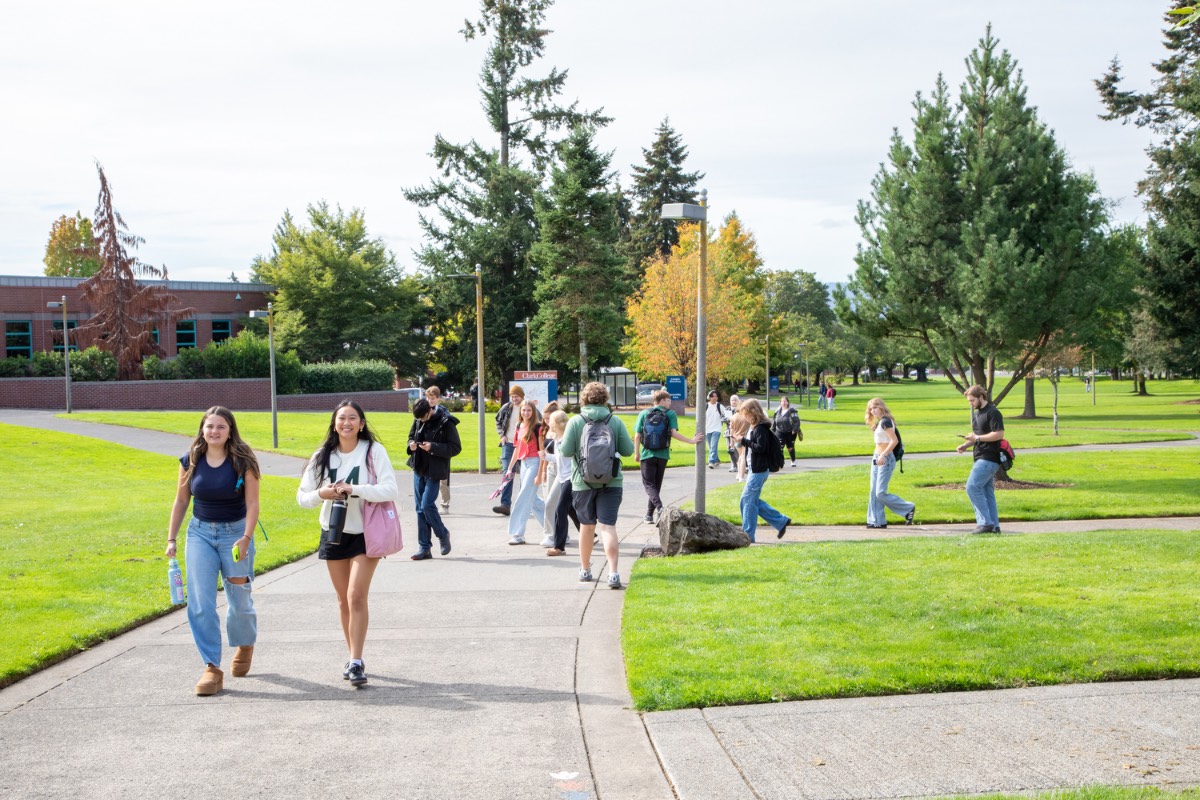 Photo of many students walking around Clark's campus on a sunny day.