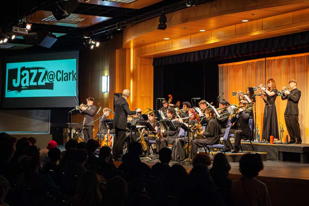 A ensemble of student musicians performing at a jazz festival concert.