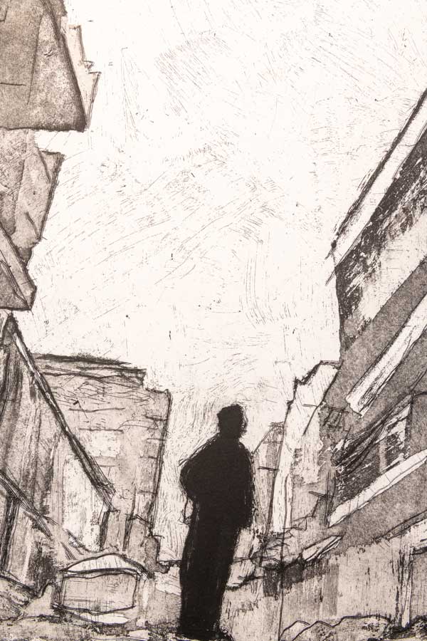 A black and white composition of a person standing in the middle with buildings all around them.