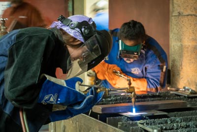 Placedholder text A Clark student welding