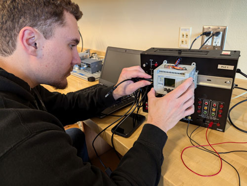 An MTX student working on his capstone project