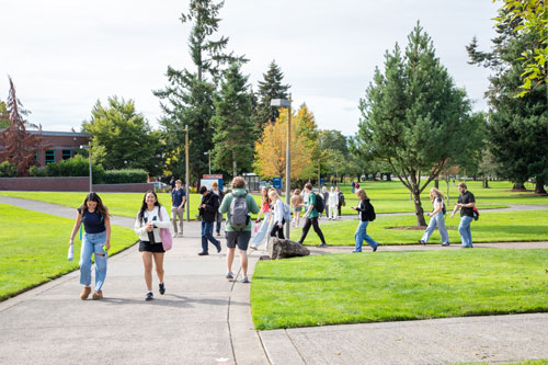 A group of students walking across campus.