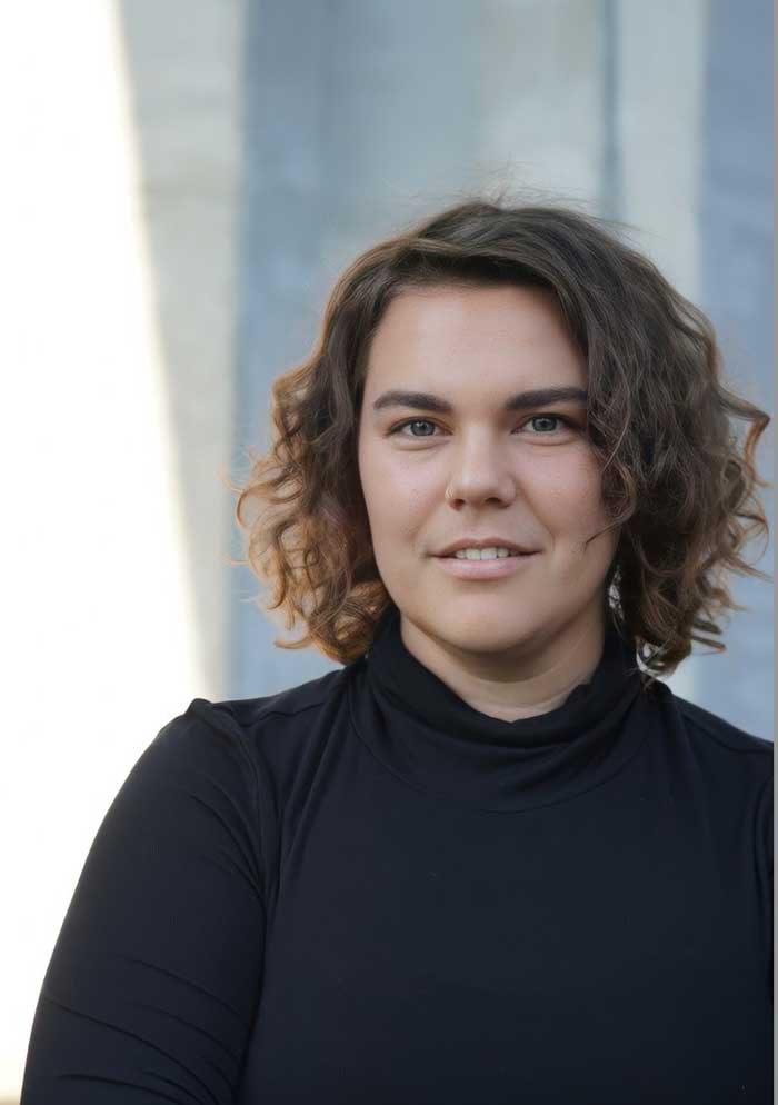 Portrait of climate journalist and fiction writer Emma Pattee.