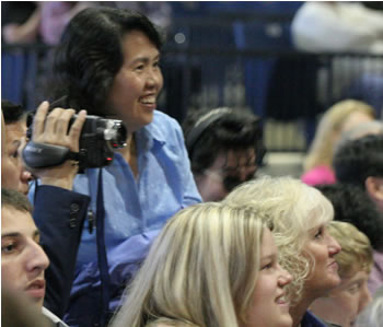 Families videotape the commencement ceremony