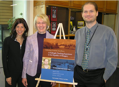 Coordinators Veronica Brock and Gail Liberman congratulate English professor Joe Pitkin, the first presenter in the college’s new Faculty Speaker Series.