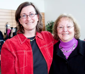 Gail Robinson (left) receives congratulations from student Doran McArthur following Robinson's Faculty Speaker Series presentation. 