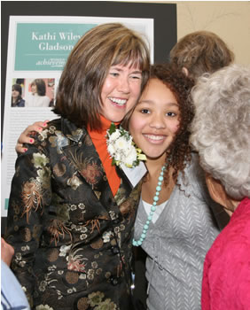 2007 Woman of Achievement Kathi Wiley Gladson gets a hug from an admirer. 