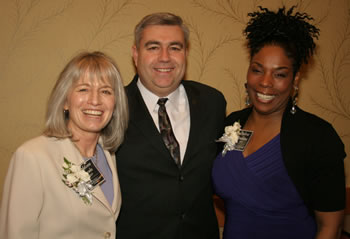 Clark College President Bob Knight congratulates two of the 2009 Women of Achievement, both of whom have ties to the college: Addison Jacobs, director of public affairs for the Port of Vancouver and member of the Clark College Board of Trustees, and Debra Jenkins, professor of early childhood education and psychology at Clark.