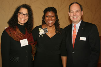 Director of Equity and Diversity and 1998 Woman of Achievement Leann Johnson and Trustee Jack Burkman congratulate Vancouver-area consultant Carol Parker Walsh for being named a 2009 Woman of Achievement.