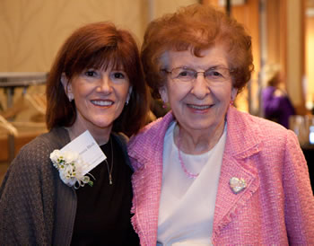 Woman of Achievement Donna Bleth (left) is congratulated by former State Rep. Val Ogden