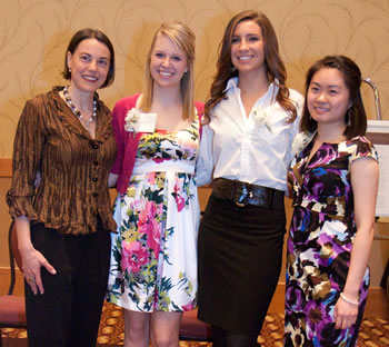 YWCA Clark County Executive Director Kathy Kniep congratulates Young Women of Achievement Holly Vogel, Nadia Mousleh and Jing Xue.