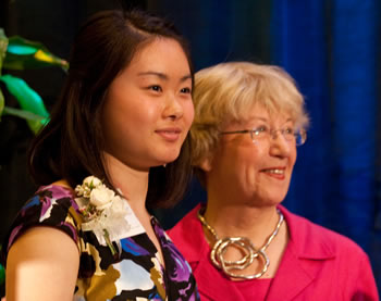 Young Women of Achievement Jing Xue (left) received a $1,500 scholarship from Clark College faculty emeritus Donna Roberge. Roberge established the first Young Woman of Achievement scholarship.